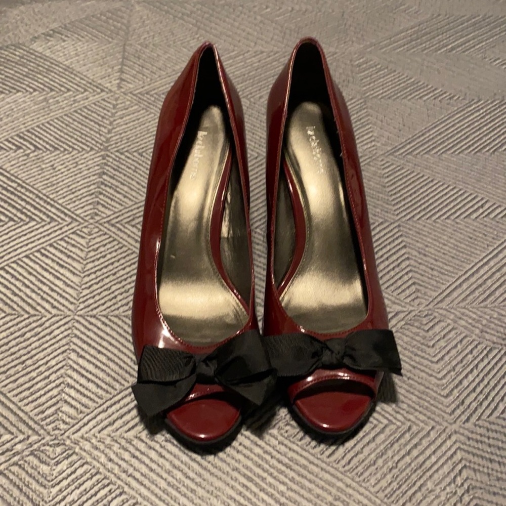 Maroon patent leather peep toe pumps